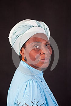 African woman  wearing a white  turban