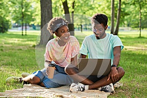 Young people sitting in the park