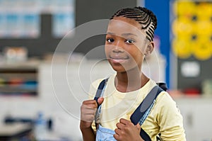 Girl wearing backpack at school photo