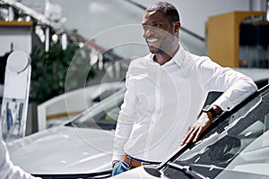 Africanamerican man came to see automobiles in dealership