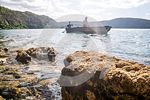 Africans in canoe on beautiful Chala lake, Kenya and Tanzania bo