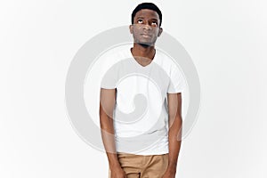 Afrikaans man white T-shirt on a Light background Copy Space