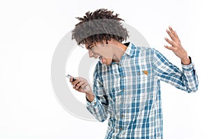 Afro amerian man screaming on smartphone