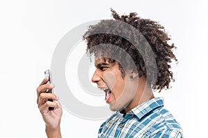 Afro amerian man screaming on smartphone