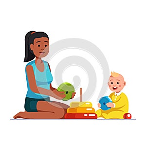 Afro American babysitter playing with baby boy