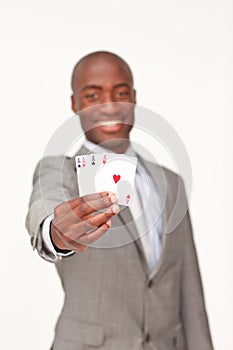 Afro-American businessman holding aces