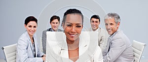 Afro-American businesswoman smiling in a meeting