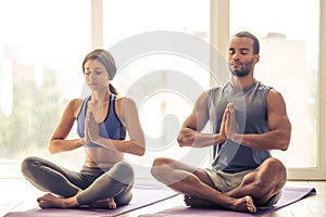 Afro American couple doing yoga