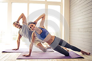 Afro American couple doing yoga