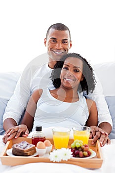 Afro-american couple having breakfast