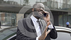 Afro-American diplomat negotiating by phone, defending his interests and opinion