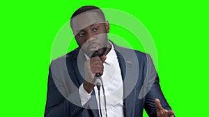 Afro-American entertainer talking on green screen.