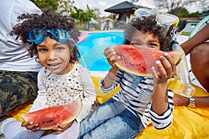 Afro-American Family\'s Poolside Watermelon Feast with Laughter and Love