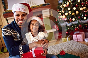 Afro American father with daughter for Christmas eve