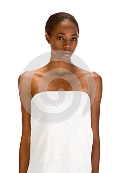 Afro-American female wrapped in white bath towel