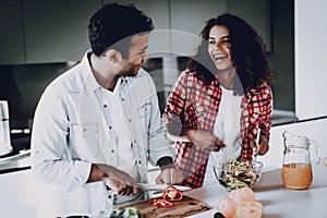 Afro American Couple Cooking At Kitchen Concept.