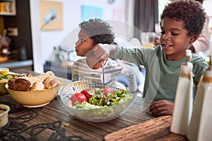 Afro-american kids eating healthy food together. brother and sister. togetherness concept