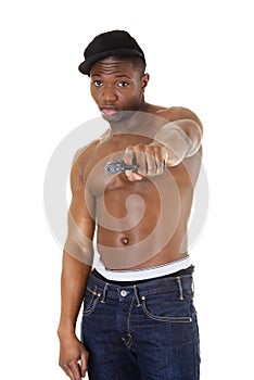 Afro american man standing with gun in hand.