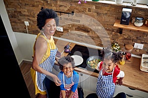 Afro-American Mother and Children Bonding in the Kitchen: Cooking Up Family Memories