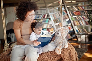 Afro american mother reading bedtime story