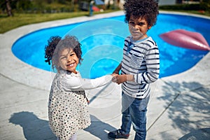 Afro-American Siblings Delight in Poolside Laughter