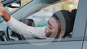 Afro american stressed woman driver african ethnic girl sitting inside luxury car screaming angry waving hands make stop