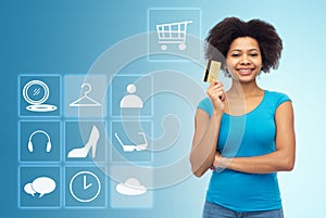 Afro american woman with credit card and icons