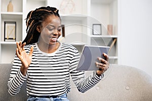 Afro American Woman Enjoying a Video Call While Relaxing at Home