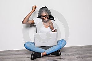 Afro american Woman with laptop on isolated white background. Work anywhere, success, freedom concept