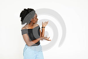 Afro american woman presenting copy space on her palm isolated on a white background