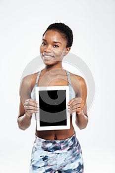 Afro american woman showing blank tablet computer screen