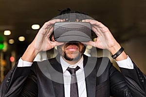 Afro businessman playing virtual reality simulation