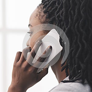 Afro Businesswoman Talking On Cellphone Looking Out Of Window, Closeup