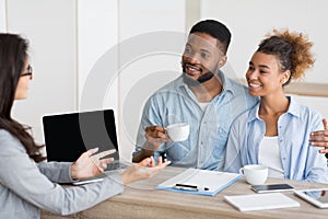 Afro Couple Attending Home Buying Consultation In Real Estate Agency