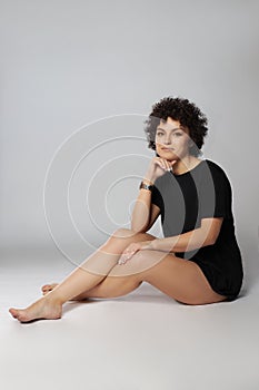 Afro curly hair fashion woman, natural makeup and cosmetics. Beauty face smile portrait of a woman with black curly hair, afro