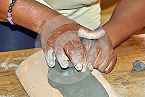 Afro-Ecuadorian hands making a mask photo