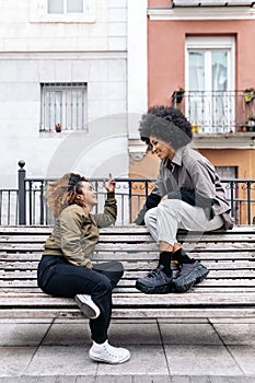 Afro Friends Sitting in Bench