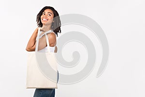 Afro girl with blank eco sack for mock up