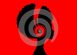 The Afro girl listens to music on headphones. Music therapy. Profile of a young African American woman. Musician avatar side view.