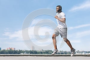 Afro Guy Running Working Out Near River In City