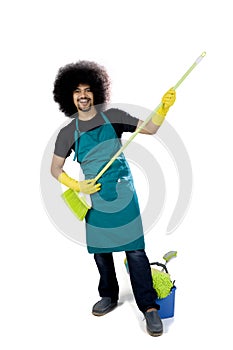 Afro janitor playing guitar with a broom