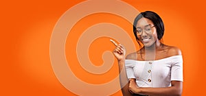 Afro Lady Pointing Finger Smiling Standing Over Orange Background, Panorama
