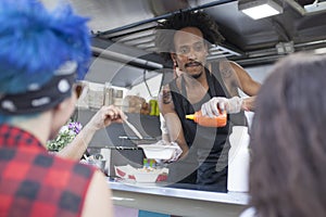 Afro man works in a Food truck