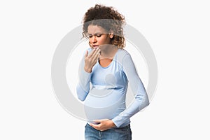 Afro pregnant lady feeling sick, having nausea on white background