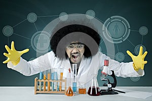 Afro scientist looks stressed with failed experiment