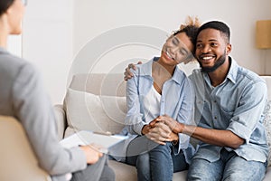 Afro Spouses Hugging Happily After Reconciling On Marital Counseling photo