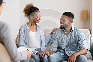 Afro Spouses Sitting At Marriage Counselor`s Office After Happy Reconciling