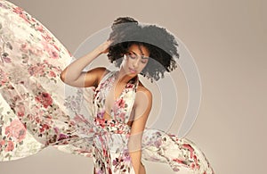 Afro woman in floral maxi dress
