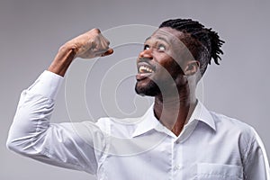 Afroamerican man with his arm raised