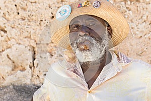 Afrocuban man smoking a cigar in Old Havana